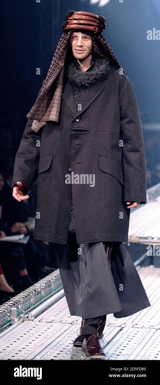a-model-for-japanese-designer-yohji-yamamoto-presents-this-lawrence-of-arabia-look-with-an-overcoat-worn-over-billowy-trousers-as-part-of-his-1996-1997-autumnwinter-collection-january-25-2D5FD80.jpeg